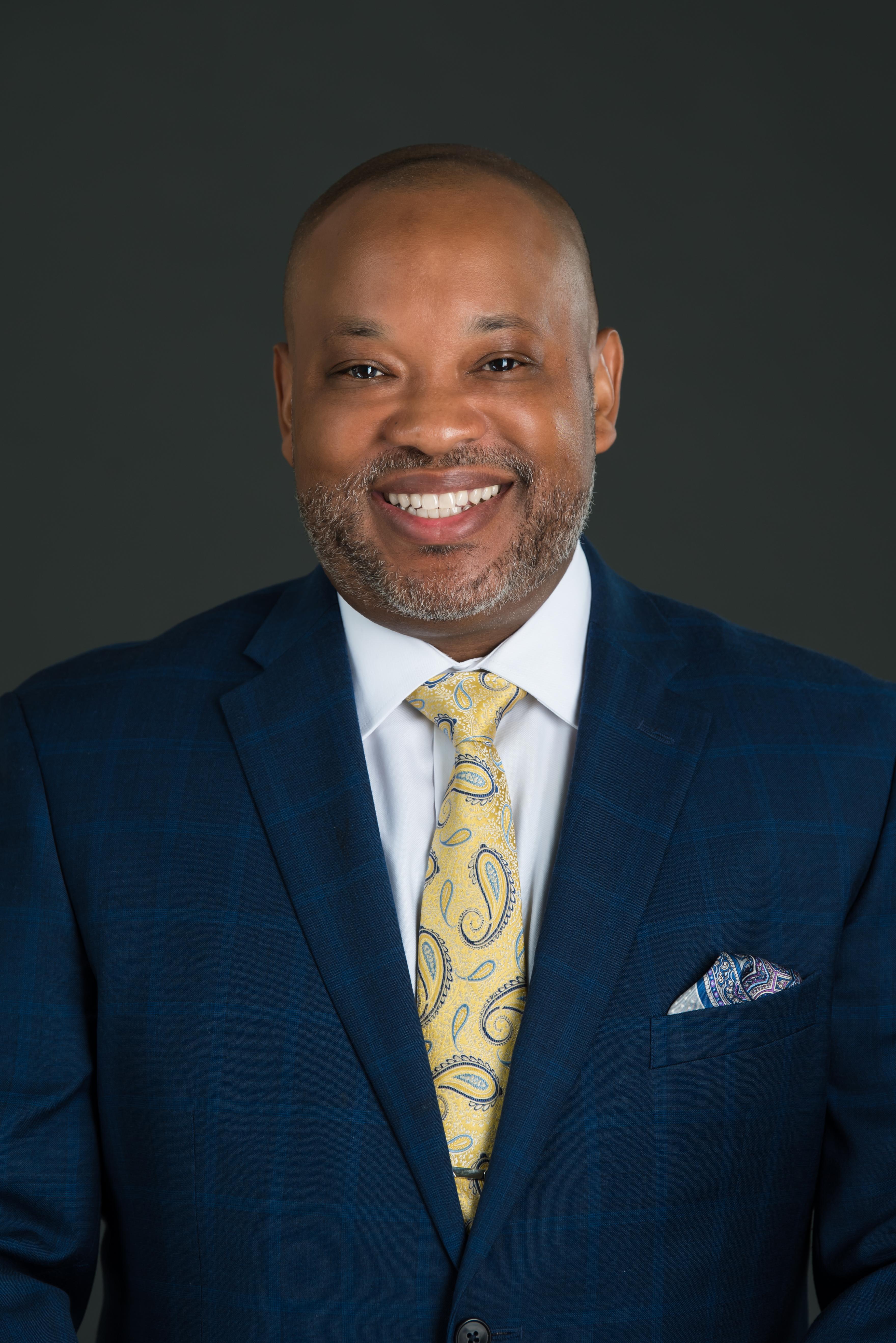 Glen Formal Headshot Front Blue Suit and Tie