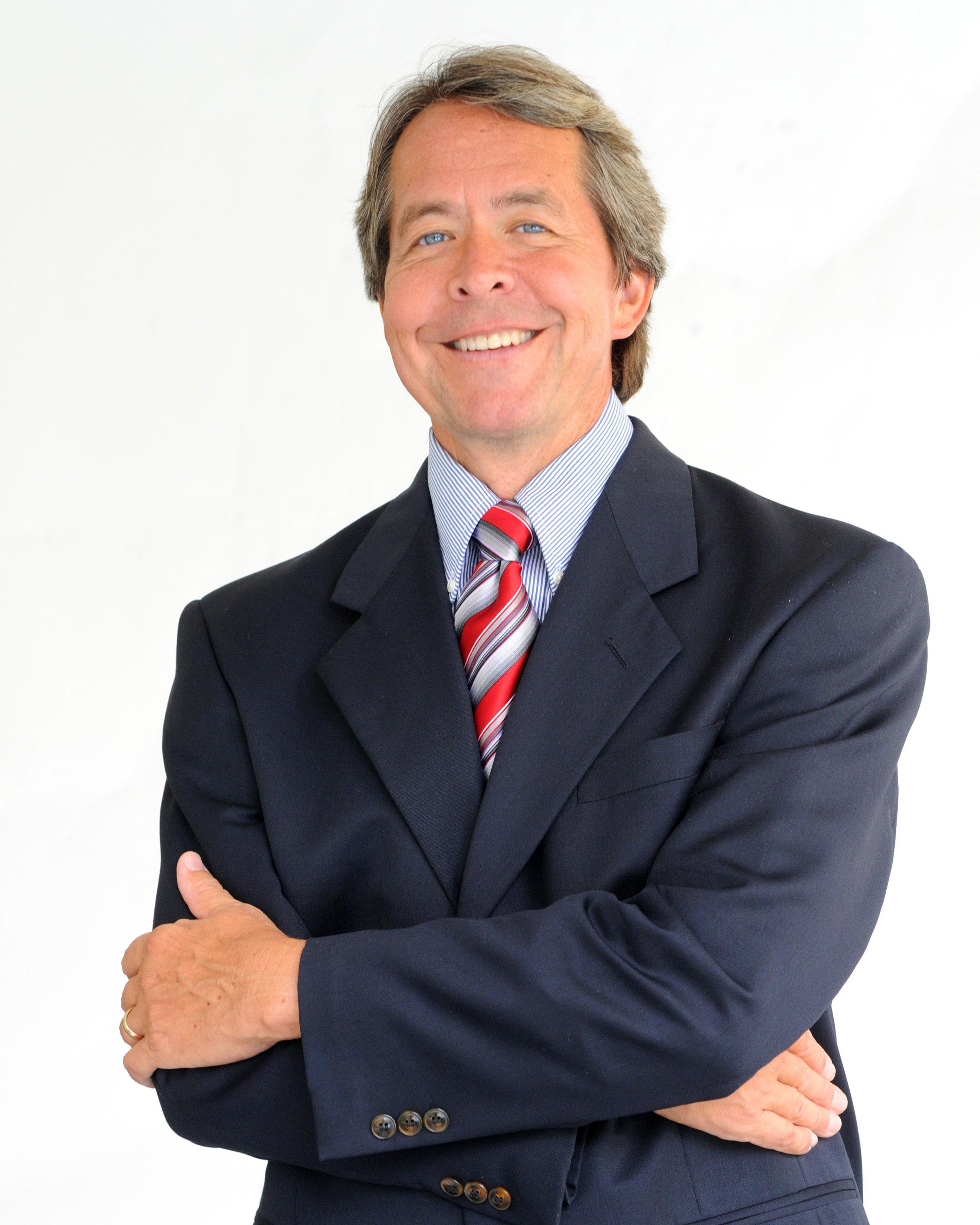 DaveDugan suit and tie arms crossed