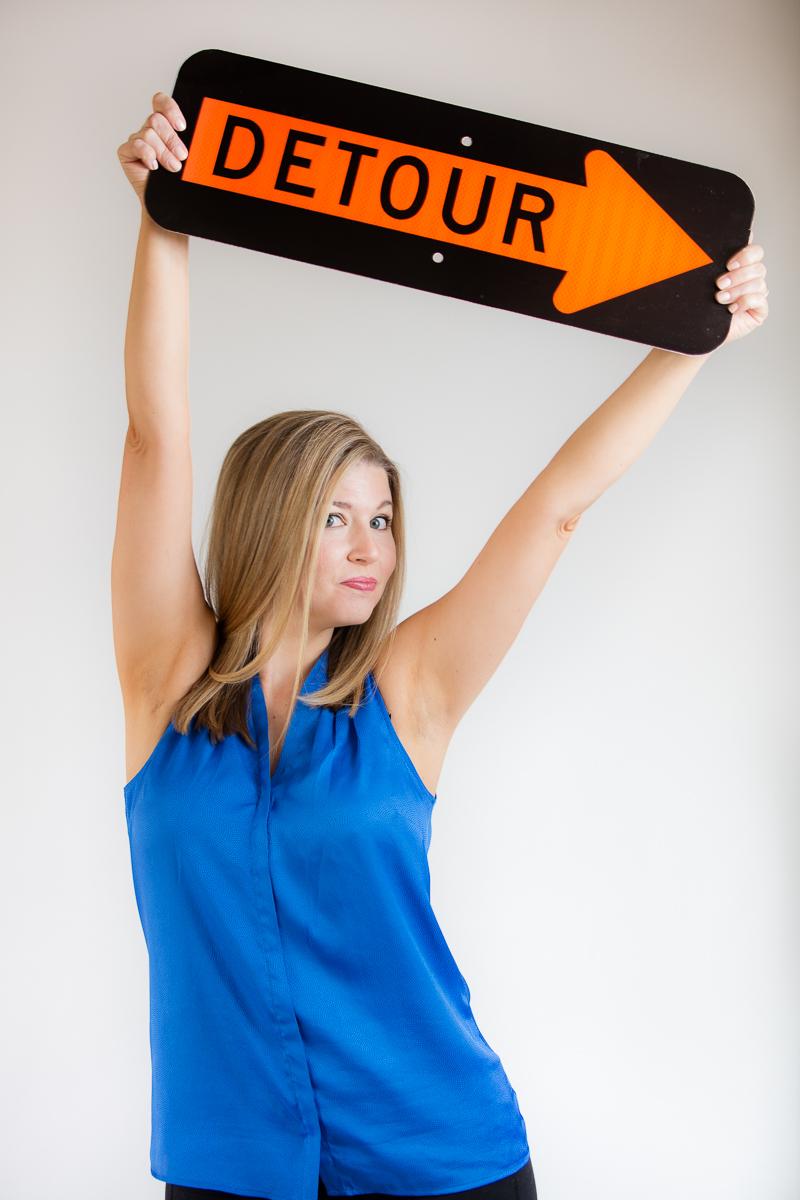 Courtney with Detour sign