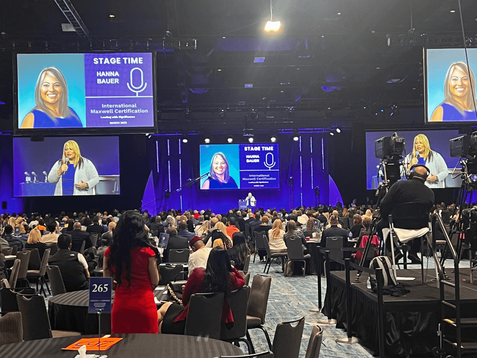 Hanna on the John Maxwell Leadership Event Stage