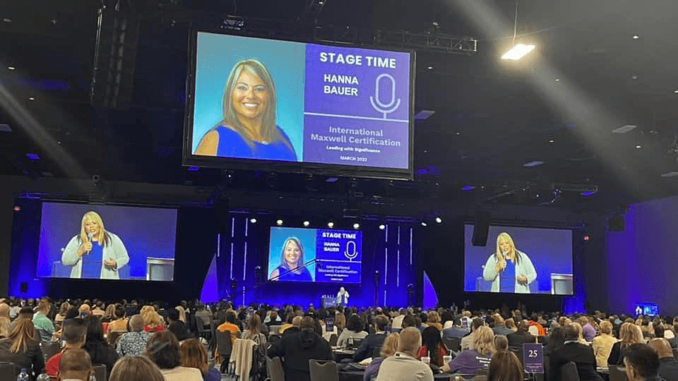 Hanna on the John Maxwell Leadership Event Stage