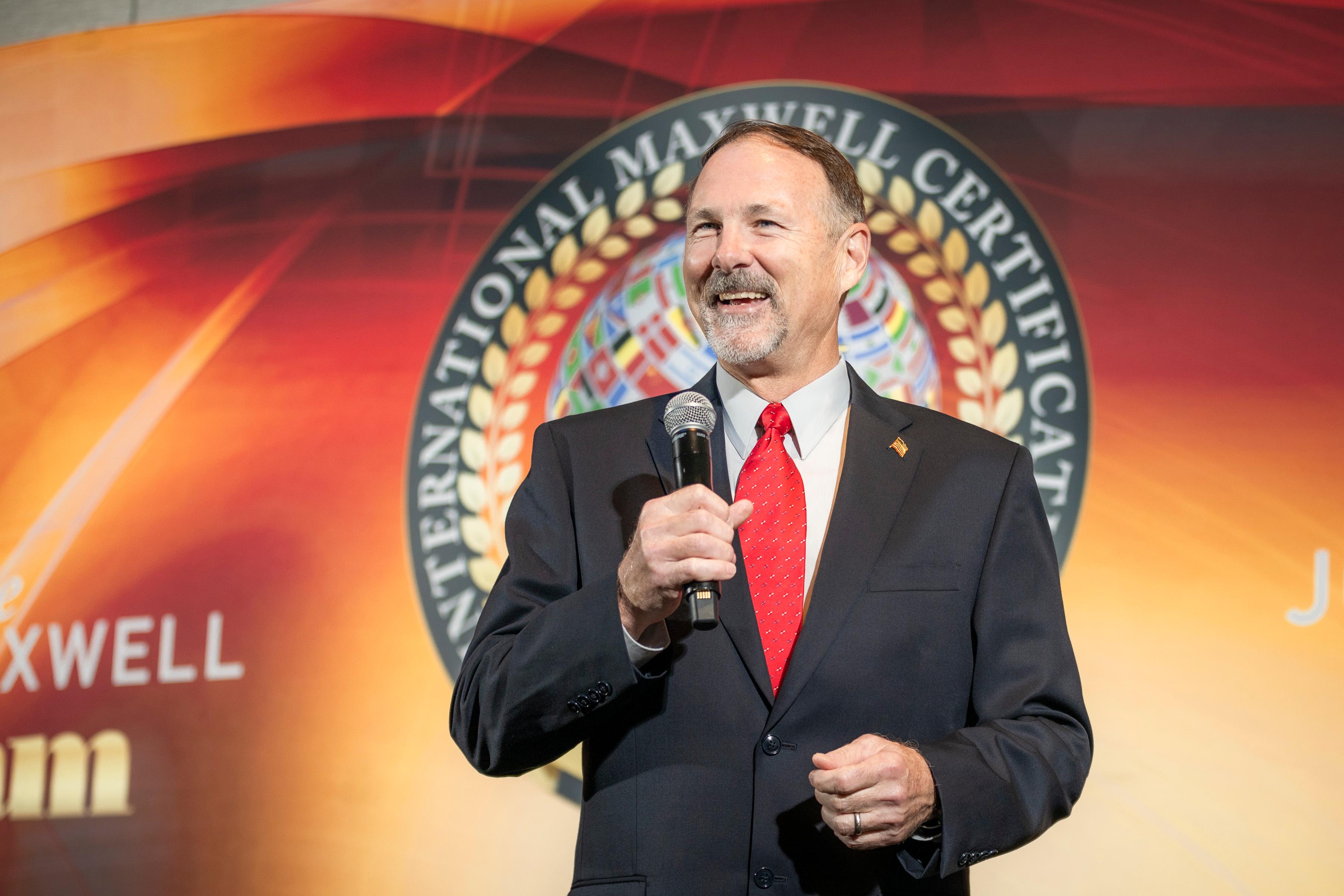 Dane with John Maxwell Team Medallion