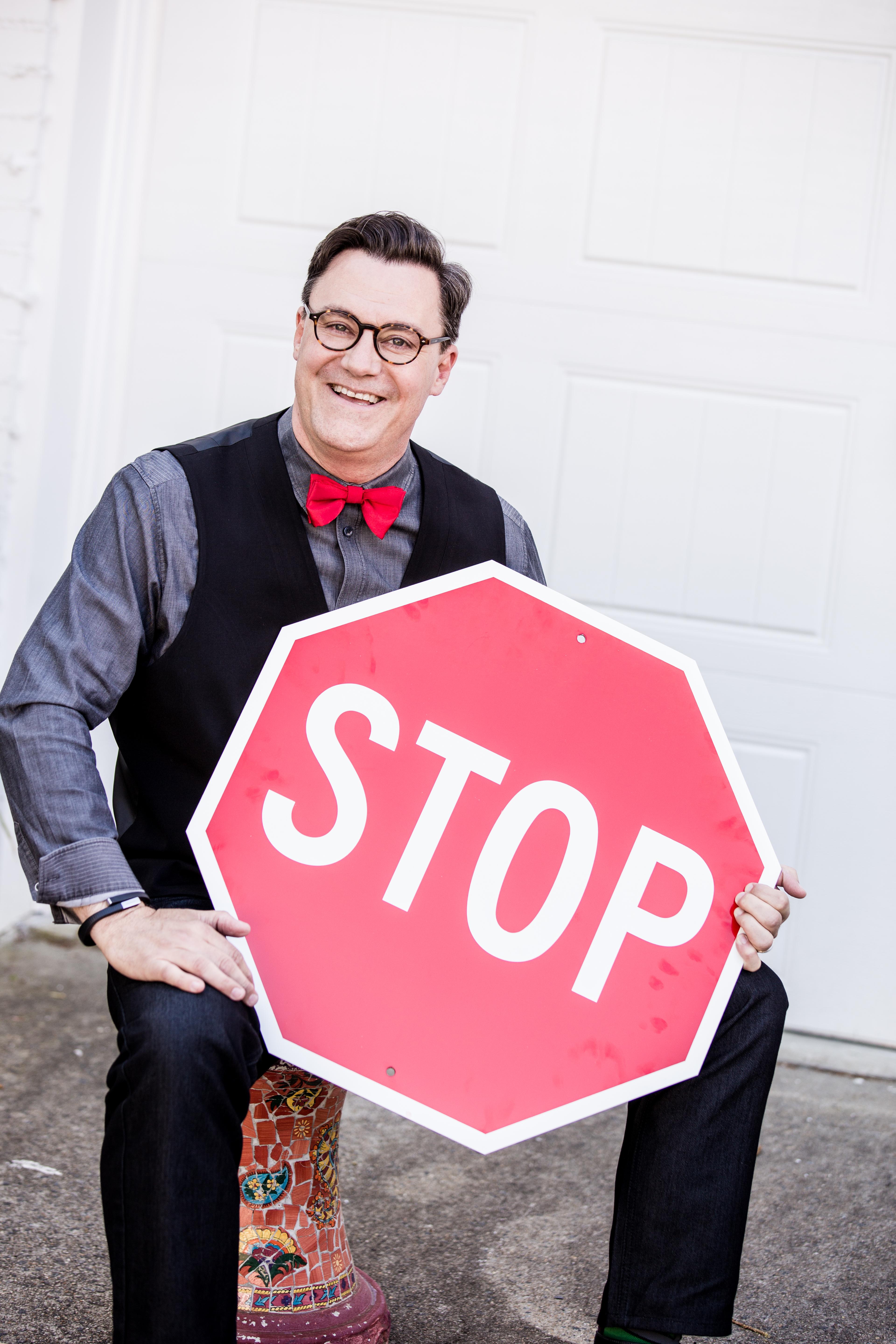 Eric Parmenter lighthearted with stop sign