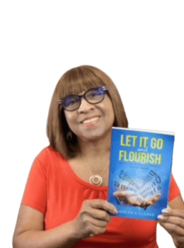 Merlyn Clarke with Picture of Book "Let It Go and Flourish.