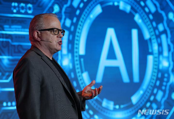 Richard on stage talking about AI