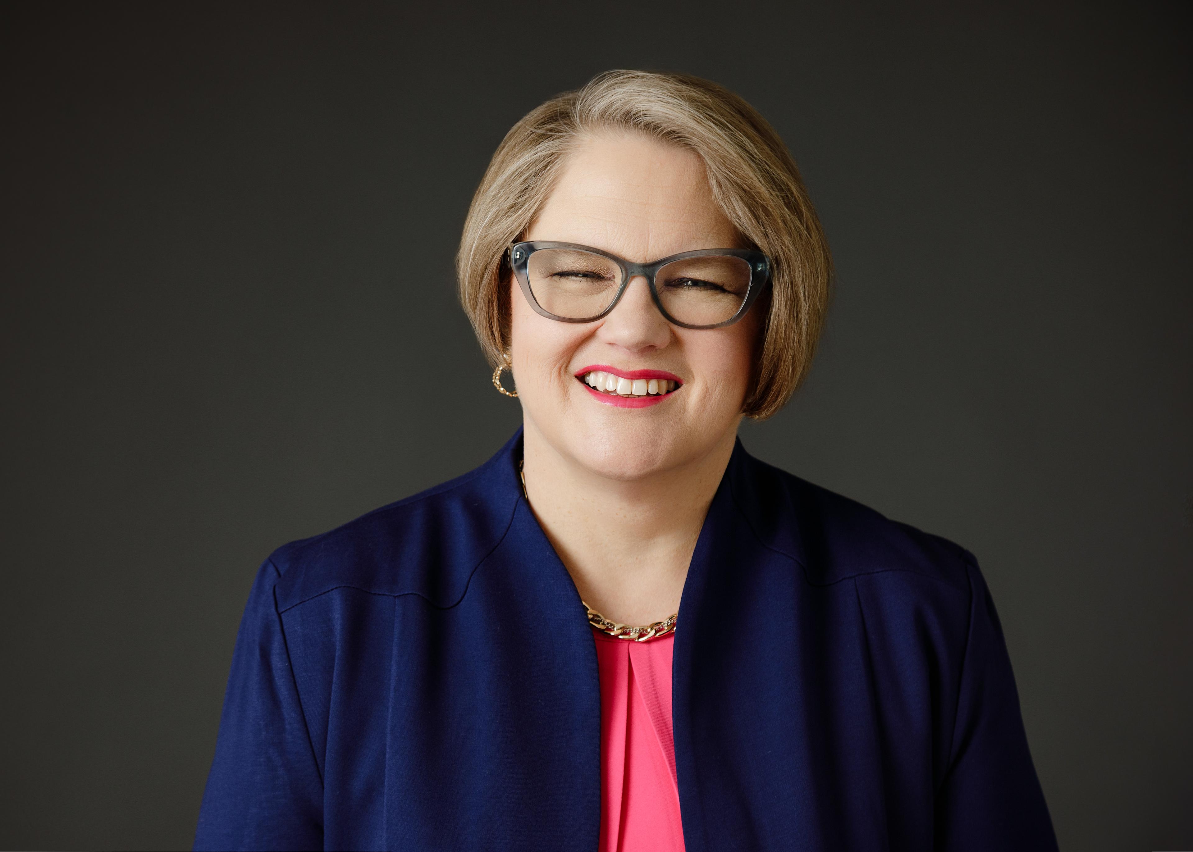 Dr. Carol Wheeler headshot dark background