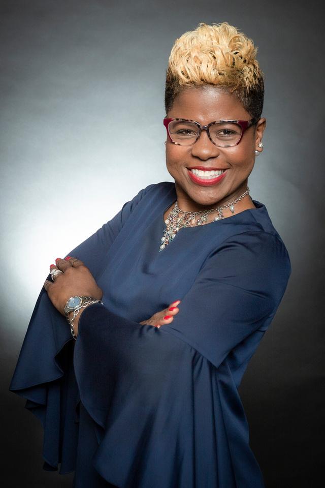 Tiffany Lewis | Vertical photo: arms crossed | color