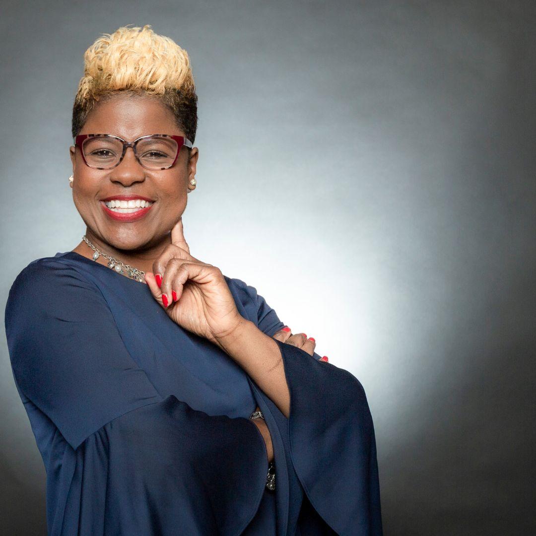 Tiffany Lewis | hands on face | facing left | color photo