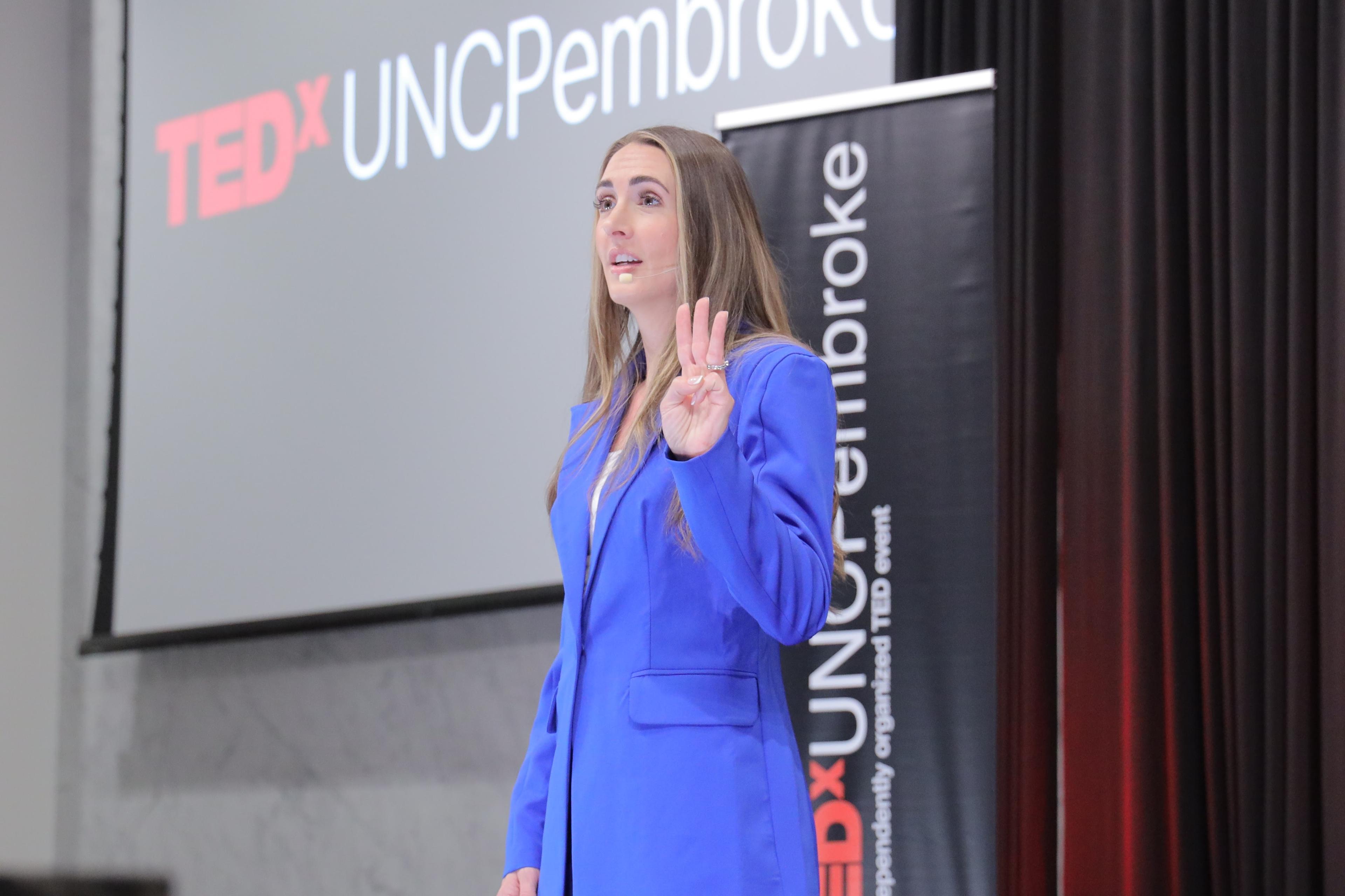 Alicia Speaking at TEDx event.