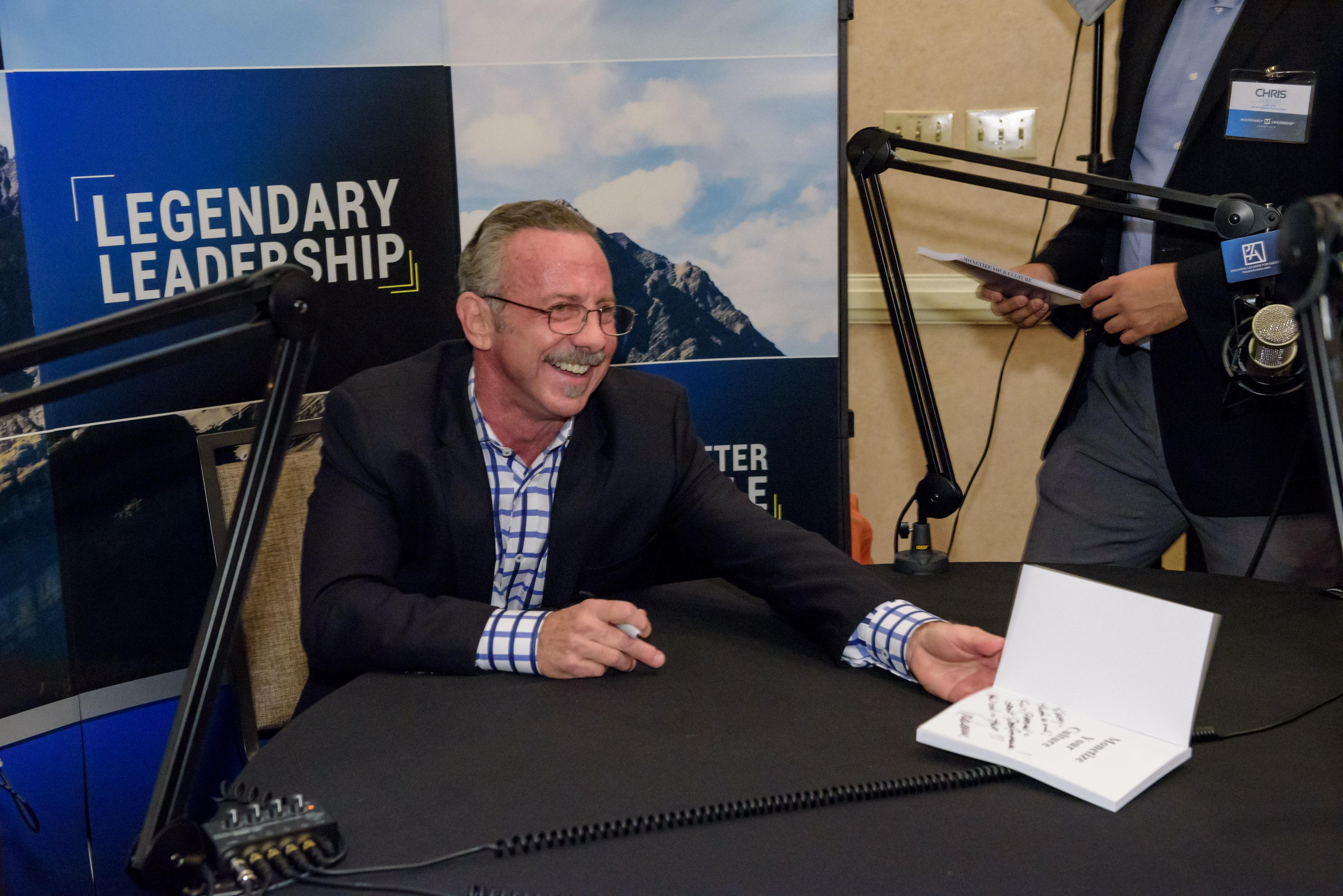 Dennis signing books at MFL Conf- such a great time after the Keynote